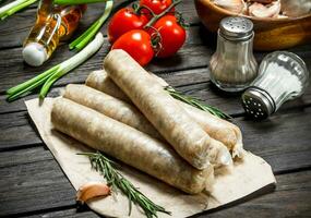 Raw sausage with spices. photo