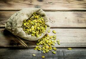 Pumpkin seeds in a bag. photo