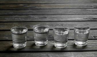 Vodka in a shot glass. photo