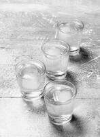 Vodka in a shot glass. photo