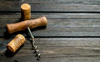 Corkscrew with corks. photo
