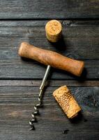 Corkscrew with corks. photo