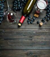 Wine background. Red wine with corkscrew. photo