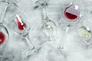 Wine background. Glasses of red and white wine. photo