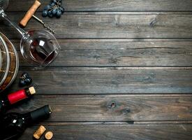 Wine background. Red wine with grapes. photo