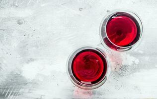 Wine background. Glasses of red wine. photo