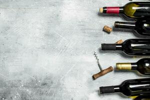 Wine background. Bottles of red and white wine. photo