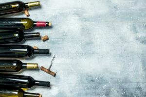 Wine background. Bottles of red and white wine. photo