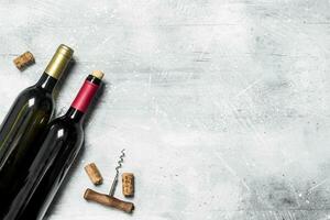 Wine background. Red wine with corkscrew. photo