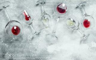 Wine background. Glasses of red and white wine. photo