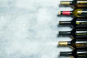 Wine background. Bottles of red and white wine. photo