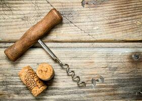 Corkscrew with corks. photo