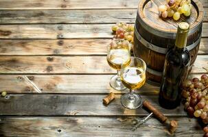 Wine background. White wine in an old barrel. photo
