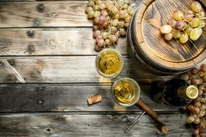 Wine background. White wine in an old barrel. photo