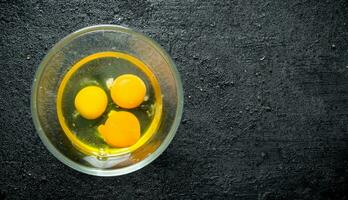 Eggs in a glass bowl. photo