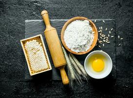 Flour, honey, egg and spikelets. photo