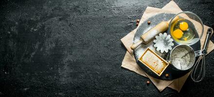 Ingredients for making dough on a stone Board. photo