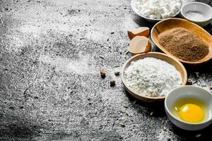 Baking background. Flour with cocoa and egg. photo