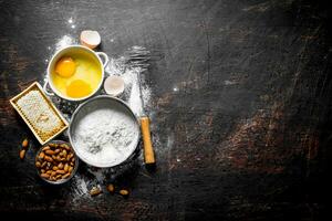 Baking background. Flour with honey, nuts and eggs. photo