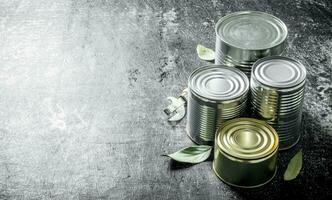 Closed cans of canned food. photo
