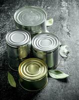 Closed cans of canned food. photo