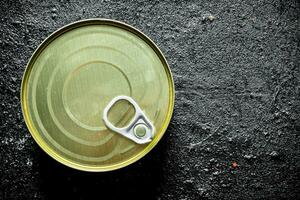 Closed tin can with canned food. photo