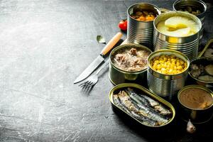 Group of open tin cans with canned food. photo