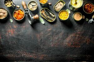 Group of different tin cans with canned food. photo