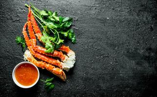 Fresh crab with herbs and sauce. photo