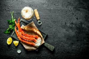 Crab with beer, parsley and lemon slices. photo