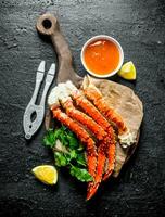 Fresh crab with lemon slice, parsley and sauce. photo