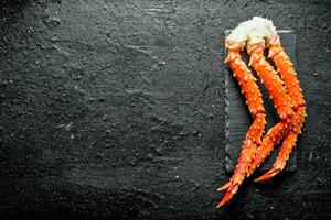 Crab on a stone Board. photo