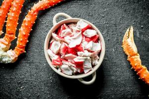 Crab meat in a bowl and boiled crab. photo