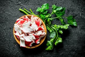 Crab meat on a plate of parsley. photo