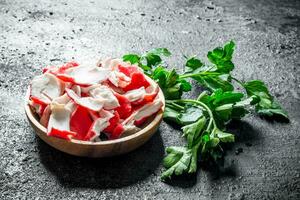 Crab meat on a plate of parsley. photo