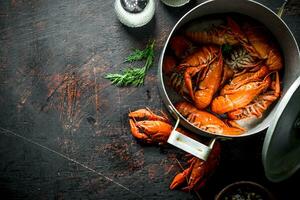 Boiled crayfish in a saucepan. photo