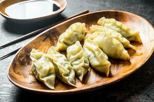 Gedza dumplings with soy sauce. photo