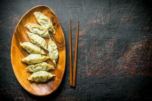 Tasty dumplings gedza on the plate. photo