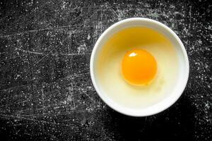 The egg in a bowl. photo