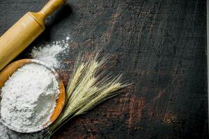 Flour with spikes and a rolling pin. photo