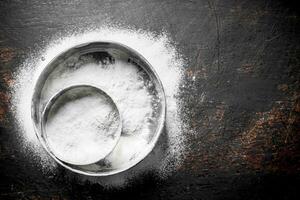 Flour in different sieve. photo