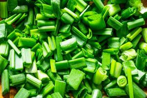 Healthy food. Chopped fresh green onion. photo