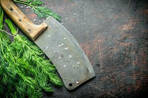 Fresh dill with big knife. photo