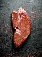 Piece of fresh raw liver. photo