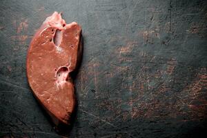 Piece of fresh raw liver. photo