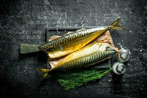 Smoked mackerel with spices and dill. photo