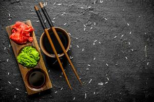 Soy sauce in a bowl with chopsticks for sushi. photo