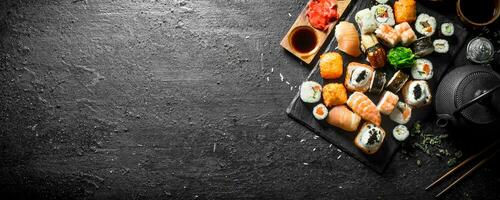 Japanese sushi rolls with salmon, avocado and shrimp. photo