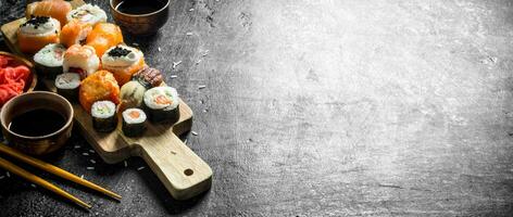 Japanese seafood sushi on cutting Board. photo