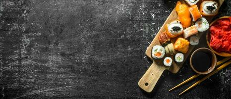 Japanese seafood sushi on cutting Board. photo